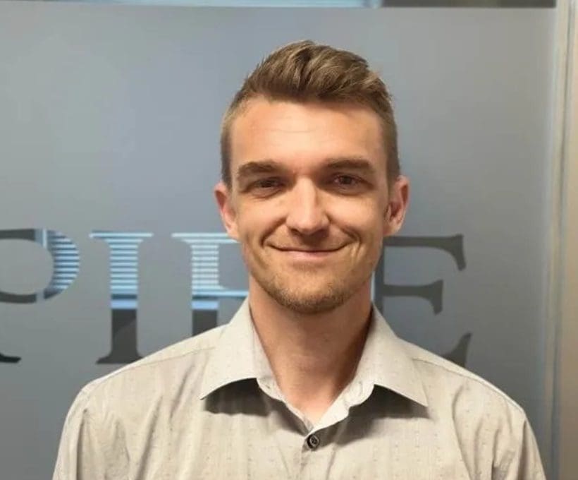 Smiling man in collared shirt